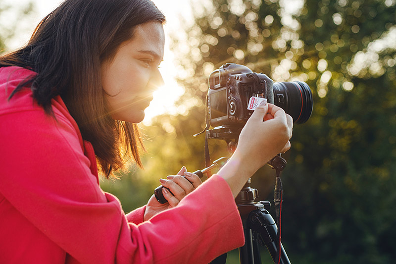 photographer loading memory card