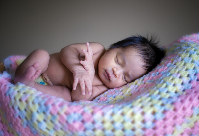 photo of newborn on baby blanket