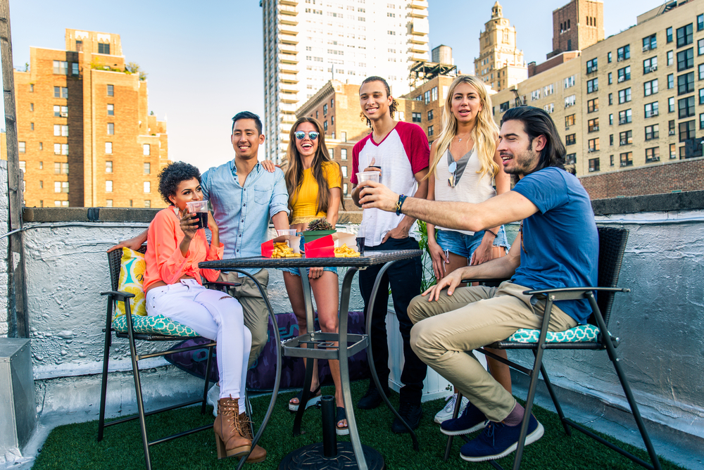 Group of friends having party on a rooftop