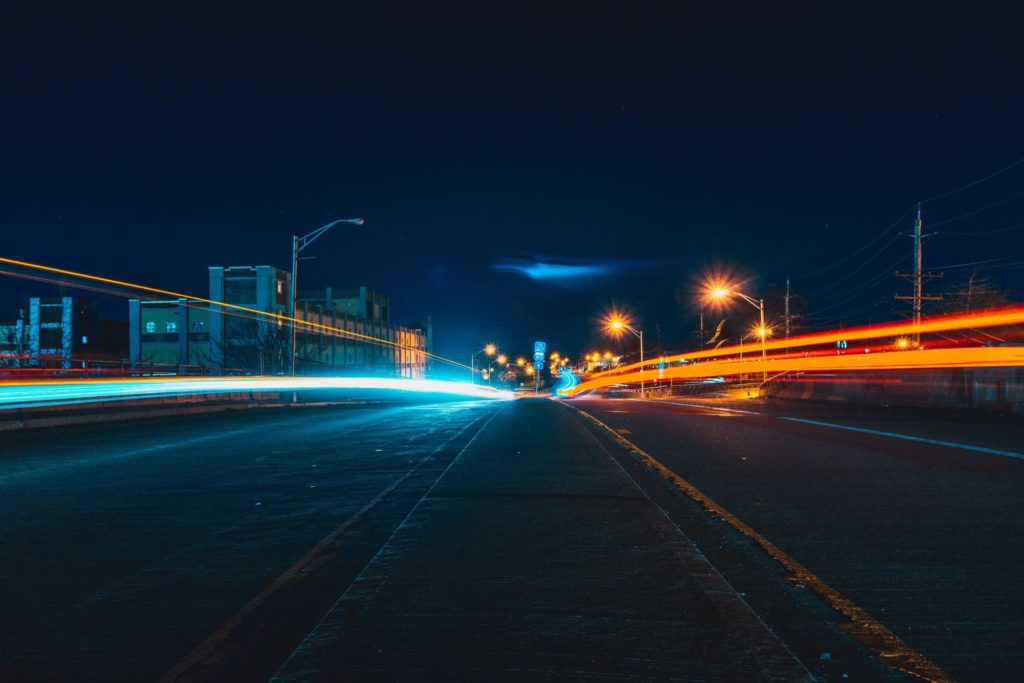 Time Lapse Photo of Light Painting of Cards on the Streets