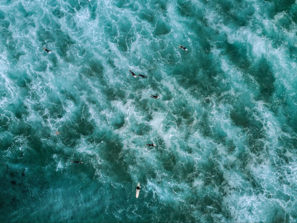 High angle Photography of People Floating on Body of Water