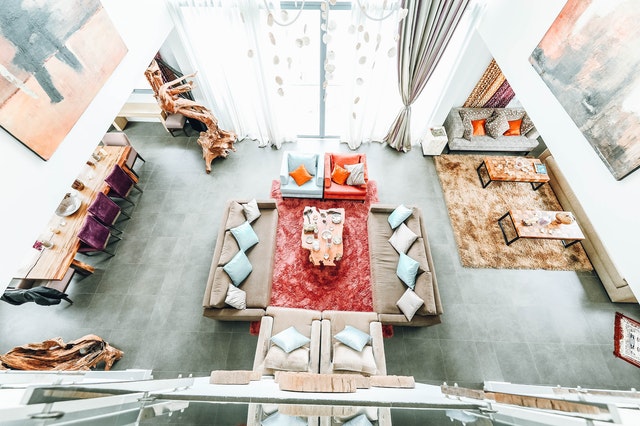 A view from the top of a living room with sofa chairs 