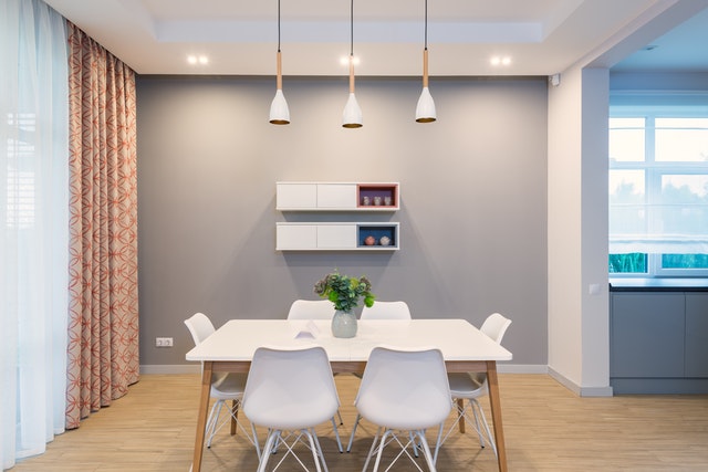 A set of table and chairs in the dining area