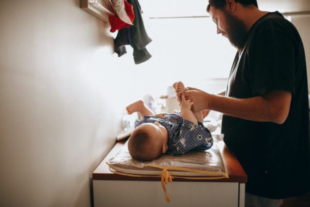 Dad changing diapers
