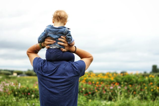 Dad and his baby on his shoulders